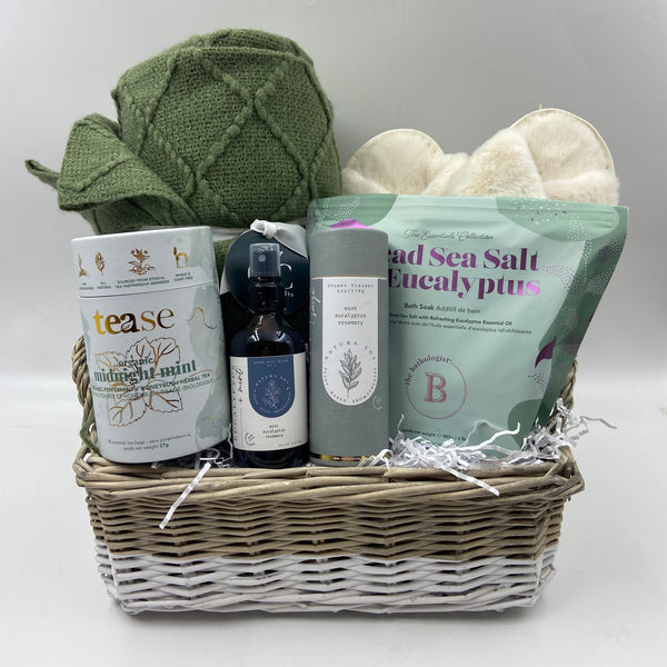 Cozy throw, plush slippers, premium tea, linen/room spray, shower steamers,  and bath salts.  Spa Gift Baskets in Ottawa