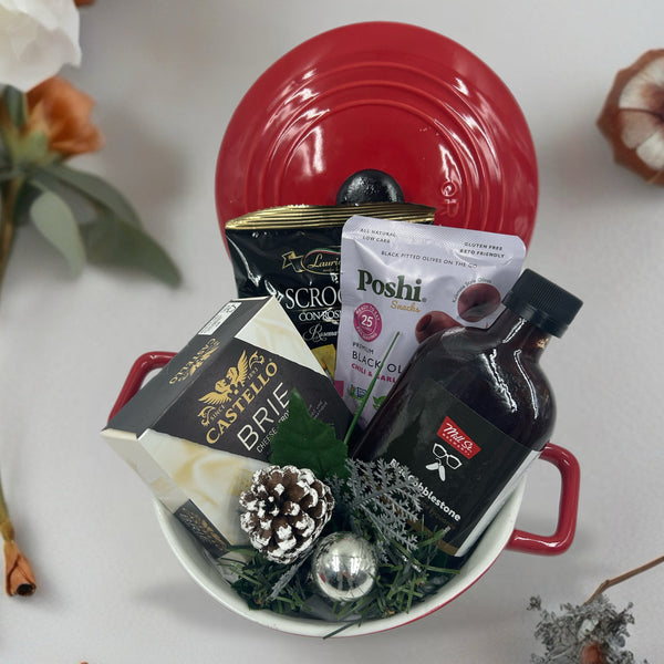 Brie baker, brie, hot sauce, crackers, olives