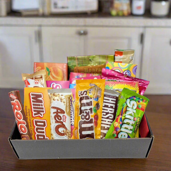assorted candies and chocolate bars in a gift box.  Birthday baskets in Ottawa