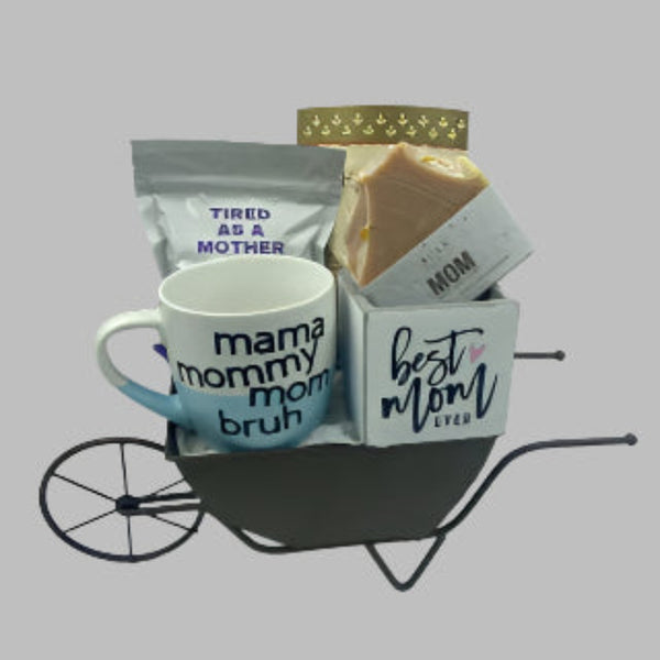 Wheelbarrow with 'tired as a mother' bath salts, premium tea, all natural soap, 'mama, mommy, mom, bruh' mug and 'best mom ever' succulent holder