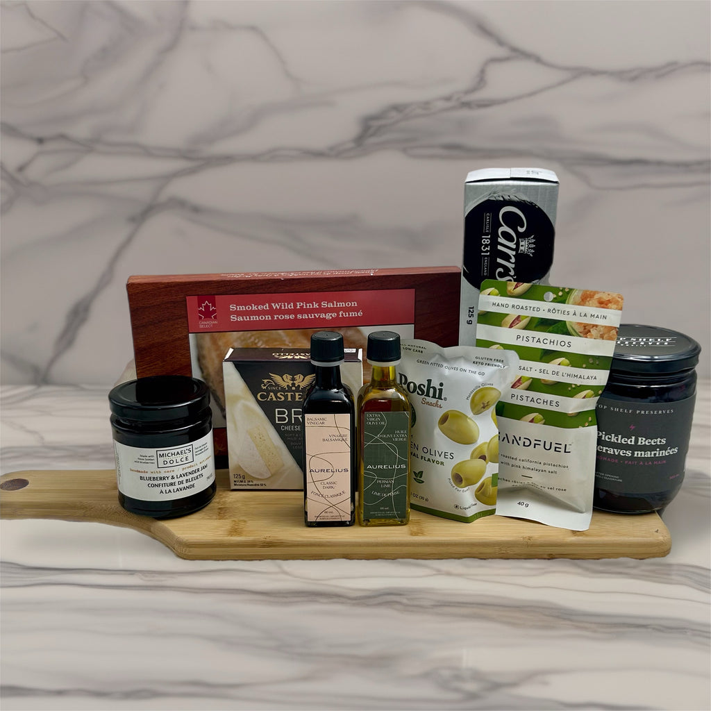 cutting board with smoked salmon, crackers, cheese, spread, olives, nuts, pickled beets, ollve oil and balsamic vinegar.  Birthday gift baskets in Ottawa