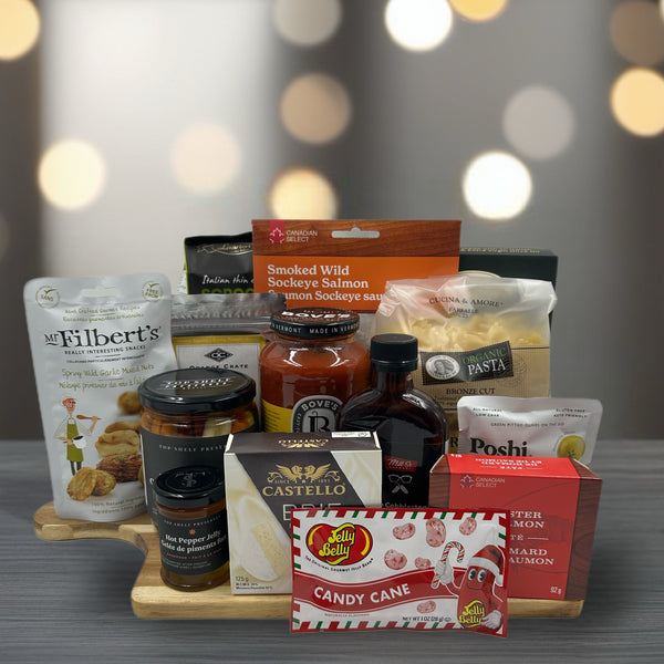 smoked salmon, crackers, nuts, jam, hot sauce, pickled carrots, dip seasoning, olives, pasta, pasta sauce, pate, jelly bellies.  Home Gift Baskets for Christmas.  Christmas gift baskets in Ottawa