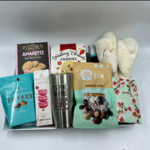 Treat her to this thoughtful tray filled with an irresistible assortment of cookies, chocolates, toffee, cozy slippers, and a stainless steel tumbler featuring the fun message "I'm fine, it's fine, everything's fine." It also includes a bottle of red wine, or white wine upon request—just let us know in the message field!