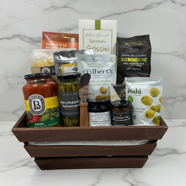 smoked salmon, olives, breadsticks, crackers, pasta sauce, noodles, 2 savoury jams, cheese and spreader, nuts, pickled beans, dip mix.  Realtor Gift baskets in Ottawa.  Get Well Gift baskets in ottawa