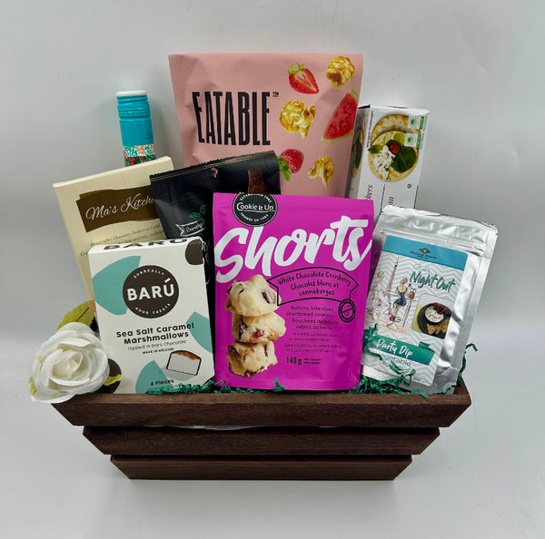 Wooden crate with sangria, Eatable popcorn, crackers, chocolate, chips, shortbread, chocolate dipped marshmallows, dip seasonings.  Gift Baskets for her from Not Just Baskets in Ottawa