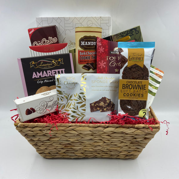 Spread joy and sweetness this holiday season with our Sweet Tidings Basket! Perfect for the office or a cozy gathering at home, this delightful collection is filled with an assortment of gourmet treats, including artisanal cookies, rich truffles, crunchy nuts, decadent chocolate bark, buttery toffee, classic biscotti, and indulgent chocolates. Each item is thoughtfully tucked inside a natural basket, bringing both rustic charm and festive cheer to any setting. Give the gift of holiday indulgence that’s sure