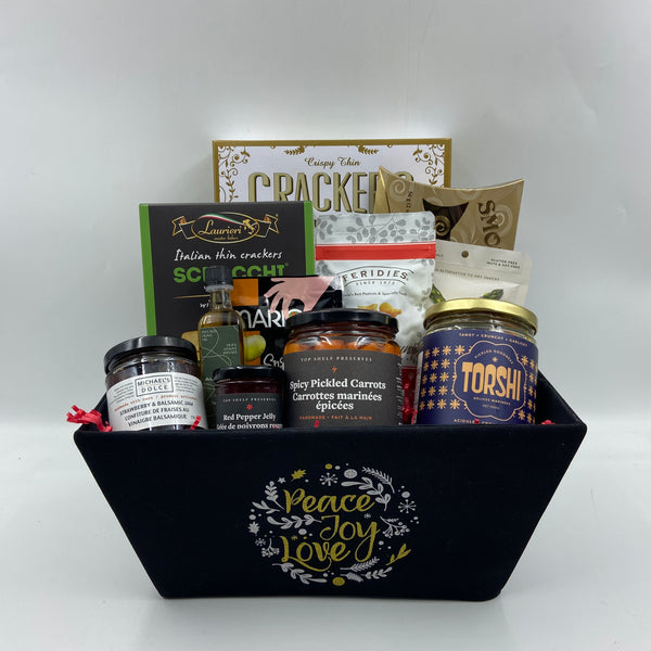 Delight in the flavors of the season with our Holiday Entertainer Basket, the perfect choice for gatherings and holiday hosting! Tucked inside a festive, reusable container, this basket is brimming with gourmet essentials: crisp crackers, premium smoked salmon, locally crafted savory spreads, infused olive oil, pickled vegetables, spicy carrots, and a medley of mixed nuts. Each item is curated to create a memorable tasting experience, whether you're sharing it with friends or gifting it to a loved one. 