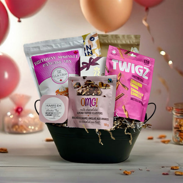 includes birthday pancake mix, hand poured candle, Pop the Champagne popcorn, pretzels, belgian chocolates, bonbons, chocolate clusters.  Birthday Baskets for her in Ottawa