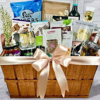  A huge wooden crate filled decadent treats and chocolate, chips, jams, nuts, pretzels, wine, and 2 custom stemless wine glasses