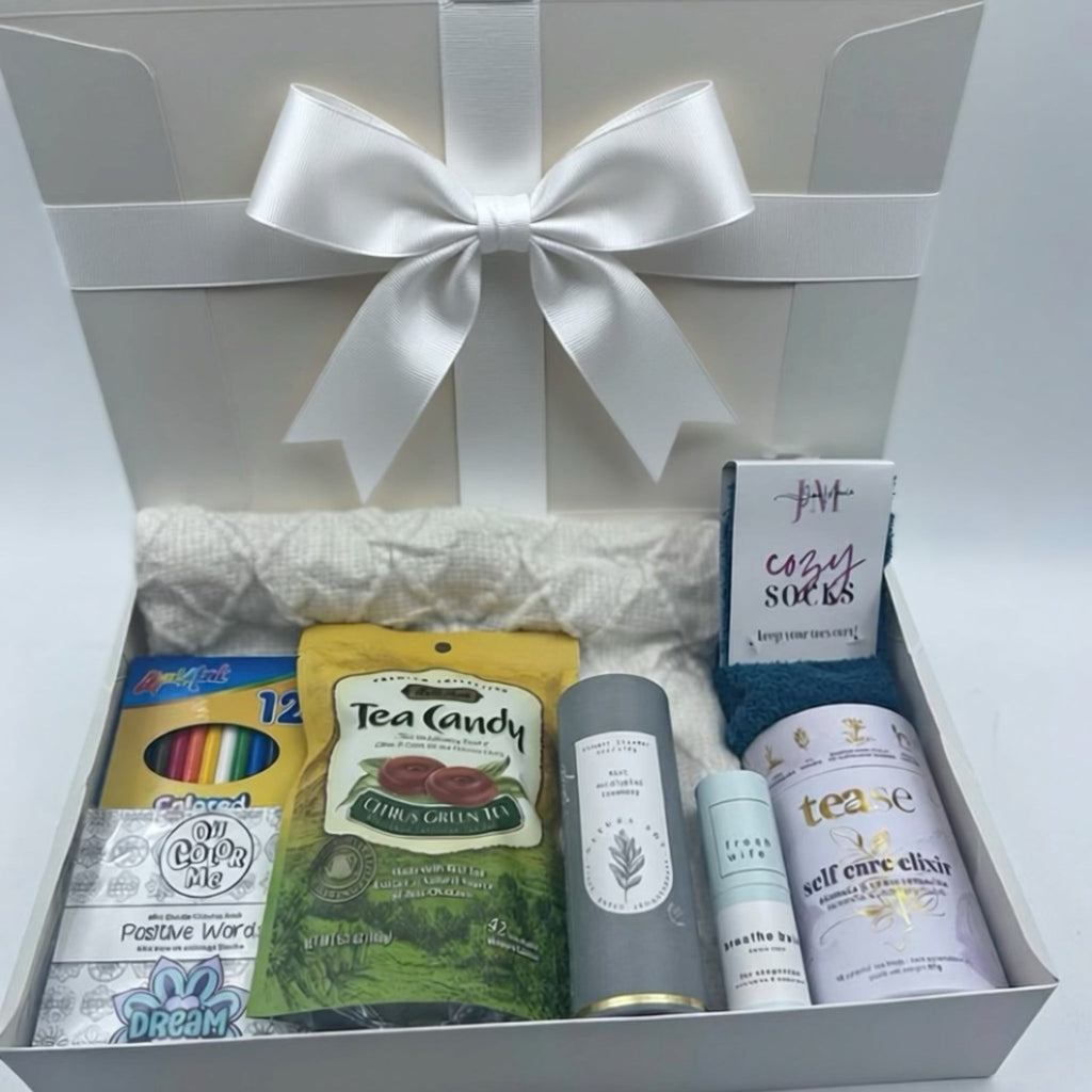 soft throw, cozy socks, premium tea, breathe balm, shower steamers, tea candies, colouring book and crayons